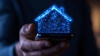 Glowing blue hologram house projection above smartphone in dark environment, depicting smart home technology and digital real estate concept.