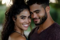 Young mixed-race couple embracing outdoors with genuine smiles, showing love and connection in natural lighting for romantic lifestyle content.