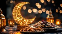 Glowing decorative crescent moon lamp with traditional Arabic lanterns, dates and nuts on wooden table against bokeh lights background. Ramadan celebration setup.
