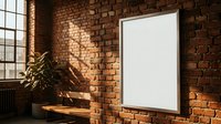 Modern loft interior with blank white frame on exposed brick wall, wooden bench and plant for mockup design presentations in industrial style room.