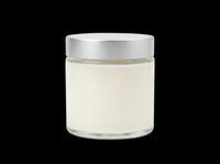 Glass jar with silver metallic lid containing pale cream product, isolated on transparent background, ready for cosmetics, skincare, beauty packaging design, t-shirt graphics, and print-on-demand projects.