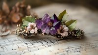Purple and pink floral arrangement with delicate blossoms resting on vintage sheet music, creating romantic nostalgic composition with soft natural lighting.