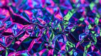 Vibrant neon foliage with electric pink, purple and green leaves creating a futuristic botanical display with intense saturated colors and dramatic lighting effects.