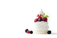 Delicate white meringue nest topped with fresh raspberries, blackberries and mint leaves on white background, elegant dessert composition with soft shadows.