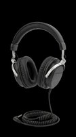 Black over-ear studio headphones with coiled cable, isolated on transparent background. Ready for music, tech, and audio gear clipart, stickers, print on demand, and t-shirt design.
