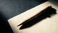 Elegant wooden pen casting dramatic shadow on textured paper surface with warm lighting for professional writing and business correspondence.