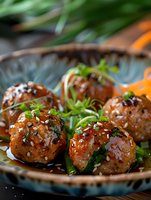 Glazed Asian meatballs with sesame seeds and fresh herbs served in rustic ceramic bowl, garnished with green onions and cilantro for appetizer presentation.