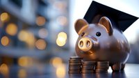 Pink piggy bank with graduation cap and coins for education savings fund and financial planning for college tuition expenses.