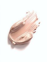 Creamy beige foundation smear with smooth texture and glossy finish on white background, showing liquid makeup consistency and coverage for cosmetic advertising.