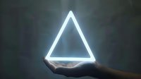 Glowing neon triangle floating above outstretched hand in dark room, creating ethereal atmosphere with bright white light against shadowy background.