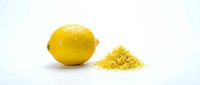 Fresh yellow lemon with grated zest pile on white background. Citrus fruit ingredient for cooking, baking and culinary preparations isolated for design use.