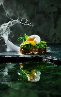 Open sandwich with poached egg, fresh greens and herbs on dark background with smoke and water reflection, dramatic food photography for restaurant menu.