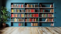 Modern home library interior with wooden floor and built-in wall shelving filled with colorful books against blue wall, decorative potted plant adds natural touch.
