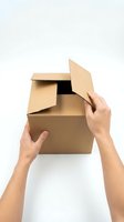 Caucasian hands opening empty cardboard box on white background, suitable for delivery, unboxing, and packaging concepts.