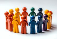 Colorful wooden figures standing in circle formation symbolizing unity, teamwork, and community. Concept of diversity, inclusion and social connection.