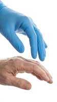 Medical professional wearing blue nitrile gloves reaching toward elderly patient hand on white background isolated for healthcare design concepts.