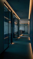 Modern office corridor with glass walls and warm LED lighting creating professional corporate atmosphere for business interior design projects.
