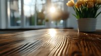 Sunlight streaming through window onto rustic wooden table surface with yellow tulips in ceramic pot, creating warm atmospheric morning glow and texture.