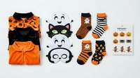 Halloween costume collection with orange and black outfits, spooky masks, striped socks and festive stickers on white background for seasonal celebrations.