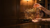 Hands holding glowing digital network sphere with interconnected light lines, representing global connectivity, data exchange, and technology innovation in modern business environment.