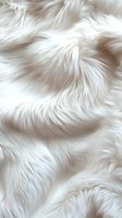 Luxurious white fur texture with soft waves and delicate highlights creates elegant background pattern for fashion, luxury goods and interior design projects.