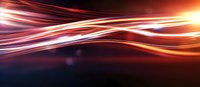 Glowing orange and red light trails create dynamic motion effect against dark background, abstract energy waves flowing with speed and movement.