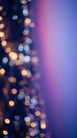 Blurred bokeh lights in warm gold and cool blue tones create an elegant, dreamy atmosphere. Soft focus background with glowing orbs transitions from dark navy to vibrant pink and purple gradient, suitable for festive, celebratory, or modern design projects.