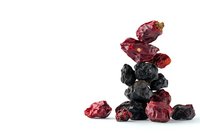 Dried cranberries and blueberries stacked on white background, healthy natural snack for nutrition and wellness. Isolated superfood composition.