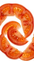 Fresh tomato slices arranged in spiral pattern on white background, isolated and ready for culinary, food packaging, recipe, and cooking design projects.