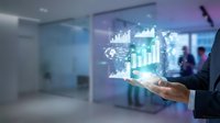 Businessman holding holographic data visualization with charts, graphs and world map in modern office environment for business analytics and global market research.