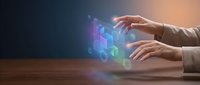 Business professional hands interacting with holographic digital technology interface displaying colorful data visualization and analytics on wooden desk.