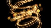 Golden light trails spiral in dynamic motion creating luminous energy waves against dark background with glowing particles and bokeh effects.