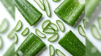 Sliced fresh cucumbers with water droplets arranged on white background, ready for culinary, wellness, nutrition, and healthy eating design projects.