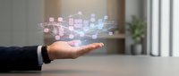 Businessman hand holding glowing digital network of connected cubes and data nodes, representing cloud computing, technology infrastructure, and business connectivity solutions.