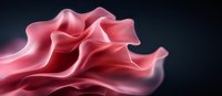 Flowing pink silk fabric creates elegant waves and folds against dark background, showcasing luxurious textile movement and dramatic lighting effects.