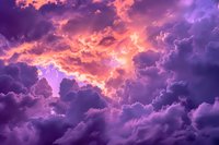 Dramatic purple and pink sunset sky with illuminated storm clouds creating ethereal atmosphere, perfect for spiritual, meditation, and inspirational designs.