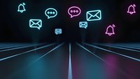 Digital communication icons floating above futuristic highway with neon lighting effects for technology and connectivity concepts.