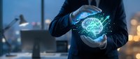 Businessman holding glowing brain hologram with digital network connections in modern office environment representing artificial intelligence and innovation.