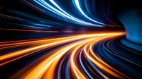 Dynamic light trails in blue and orange create futuristic motion effect in curved tunnel, suggesting high-speed movement and technological advancement in modern design.