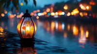 Glowing lantern on water surface with blurred city lights and reflections creating magical evening atmosphere along riverbank. Peaceful dusk scene.