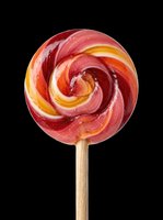 Colorful swirl lollipop on a stick, isolated on transparent background, ready for stickers, t-shirt design, clipart, and print on demand use.