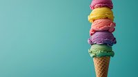Colorful ice cream scoops stacked in waffle cone against turquoise background. Vibrant rainbow colors of strawberry, mango, raspberry, lavender and mint flavors create summer treat.