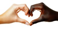 Hands of different skin tones forming heart shape against white background, symbolizing unity, love, diversity and racial harmony. Isolated on white for easy design use.