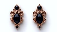 Elegant rose gold earrings with black onyx stones in vintage ornate setting on white background, isolated jewelry piece for luxury accessories and fashion design.