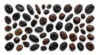 Cacao beans isolated on white background, various sizes and roasted stages, ready for design use in food, beverage, and culinary projects.