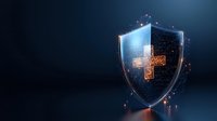 Glowing digital shield with medical cross symbol floating in dark space, representing healthcare protection and medical data security technology.