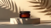 Amber glass cosmetic jar on beige podium with palm leaves shadow overlay creating minimal modern composition for skincare product presentation.