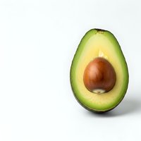 Fresh avocado half with pit on white background isolated for healthy cooking and nutrition design projects.