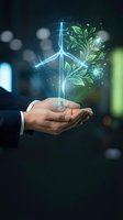 Businessman hands holding glowing wind turbine with green leaves symbolizing renewable energy and sustainable business growth for environmental projects.
