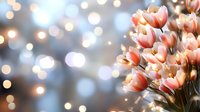 Delicate pink tulips against blurred bokeh lights background create dreamy spring atmosphere, soft focus floral composition for romantic and festive designs.